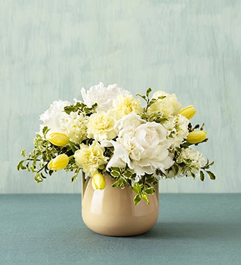 cream blossom bouquet in arts and crafts bowl