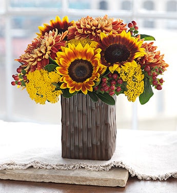 gorgeous mixed bouquet in bamboo groove vase