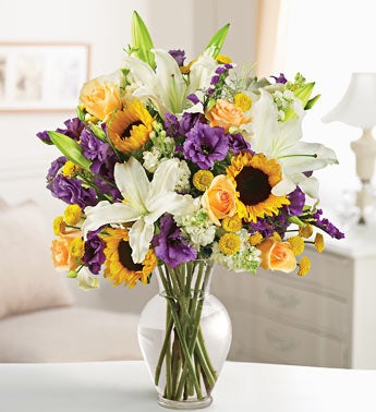 roses, lisianthus, lilies, sunflowers,blue vase